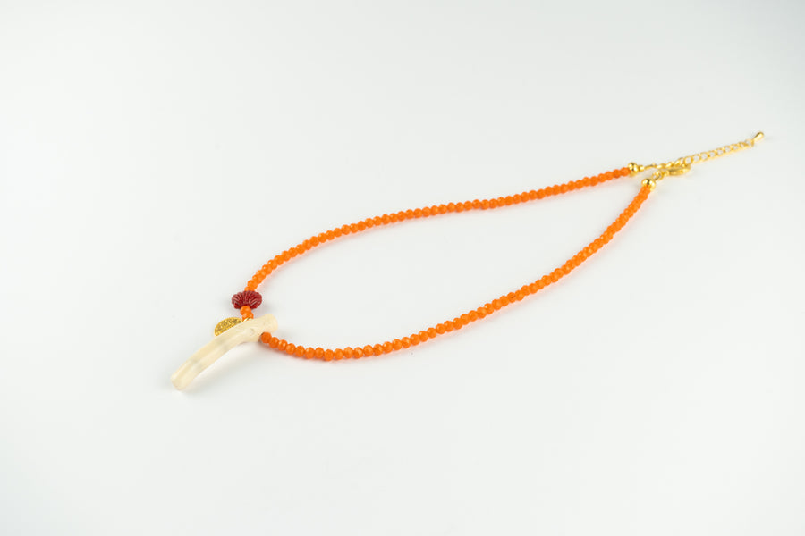 Touching orange necklace