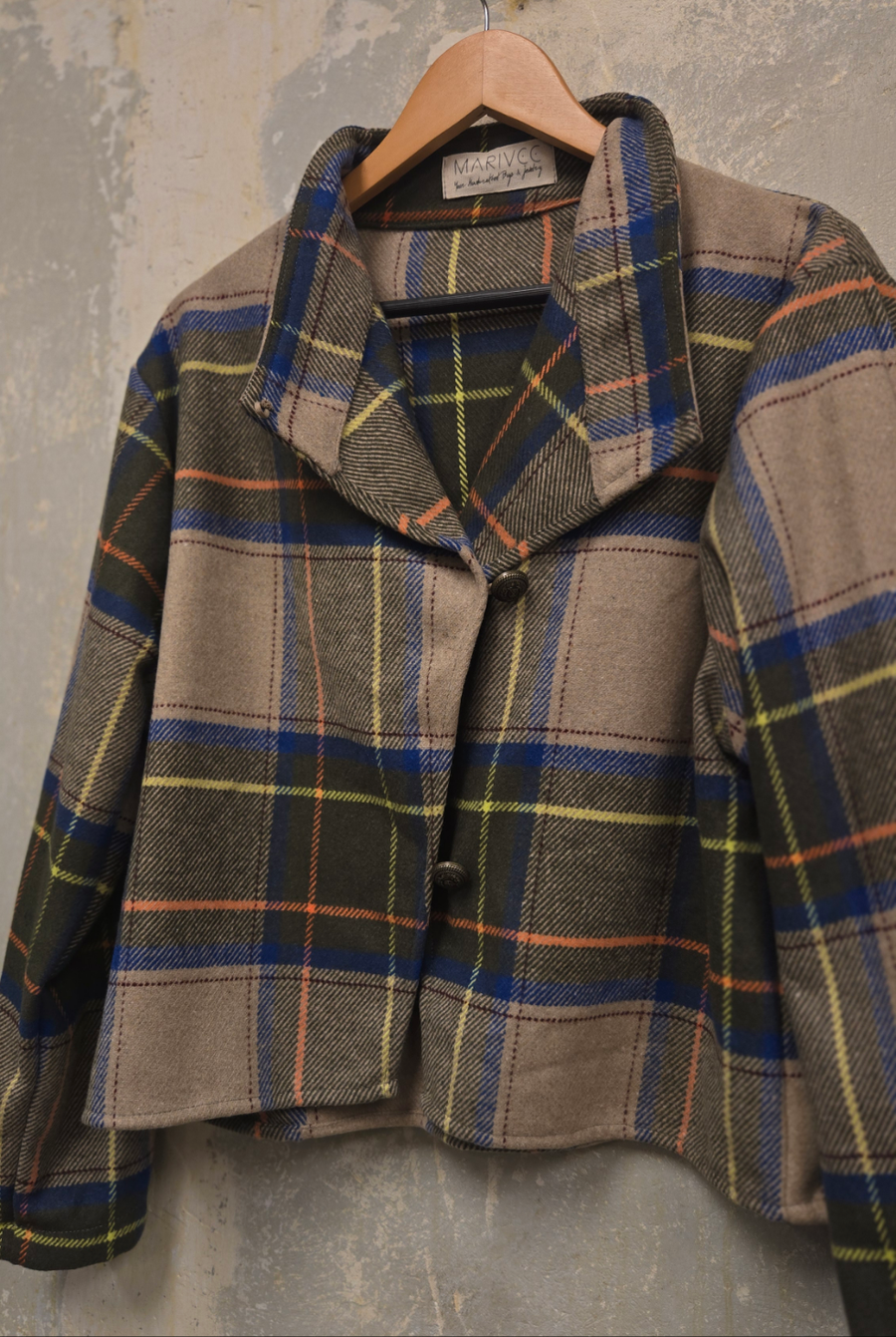 The beige checkered wool jacket