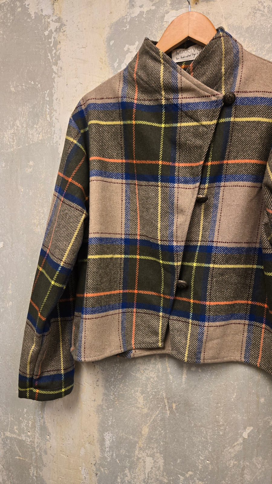 The beige checkered wool jacket