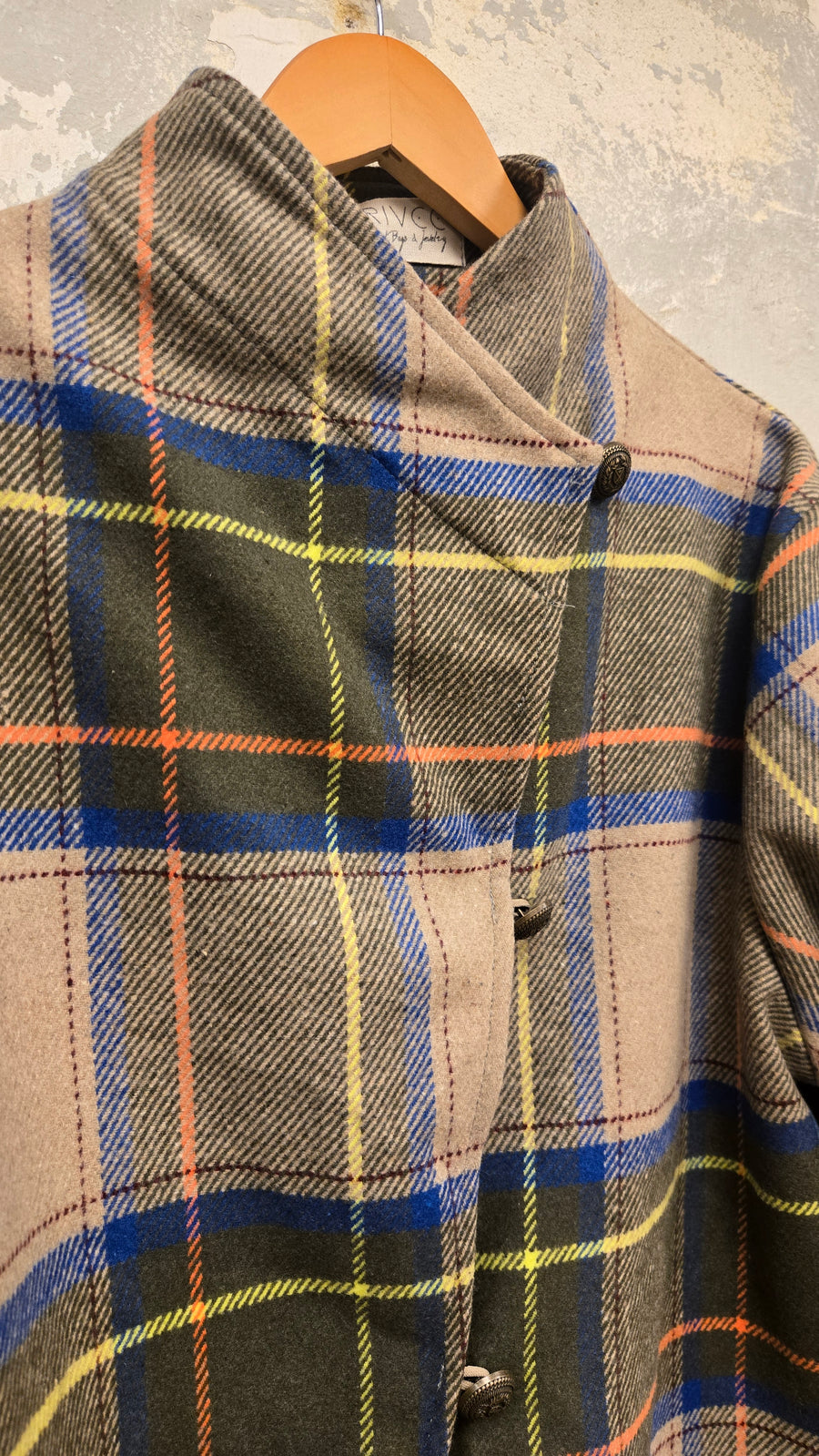 The beige checkered wool jacket