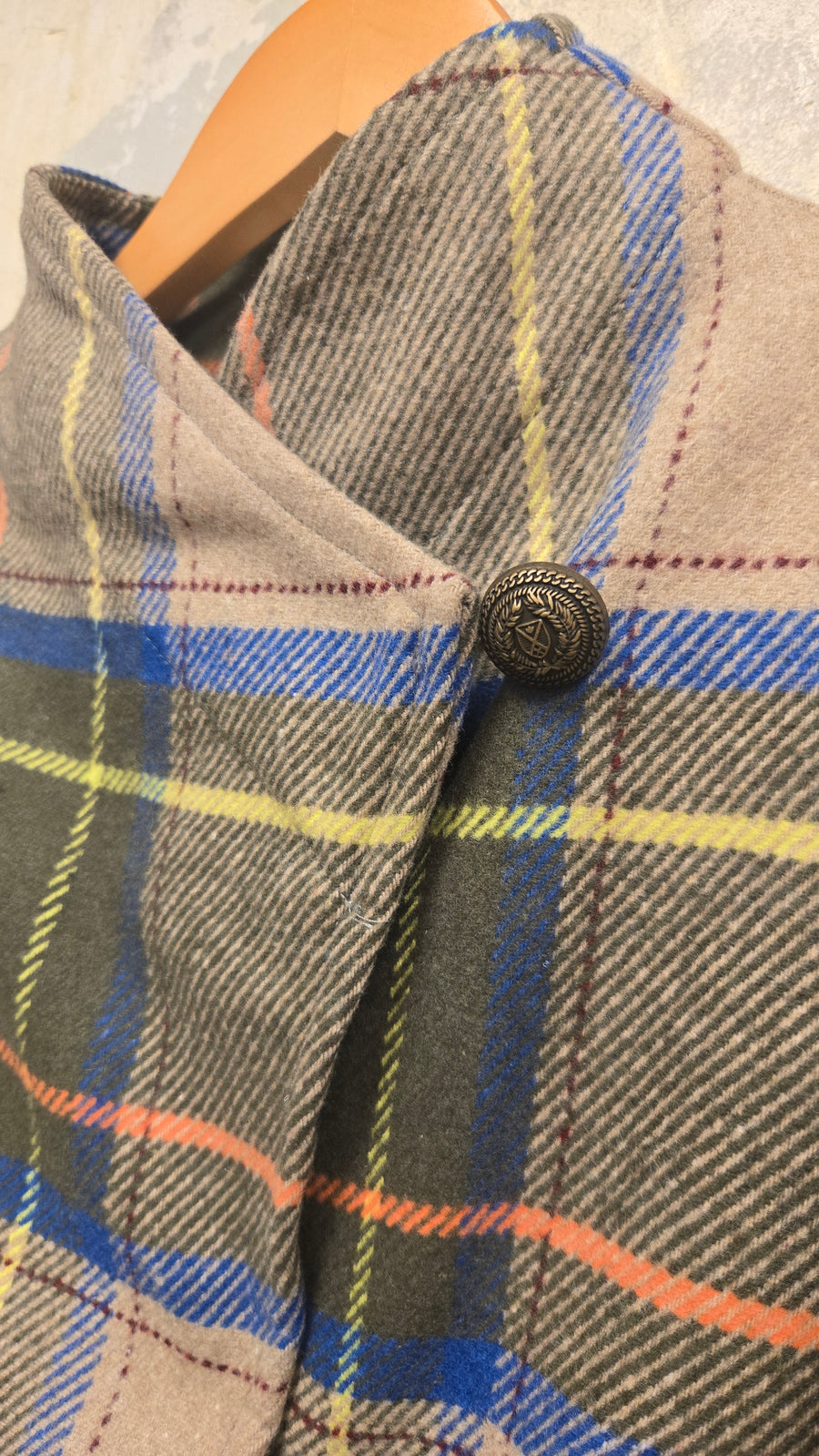 The beige checkered wool jacket