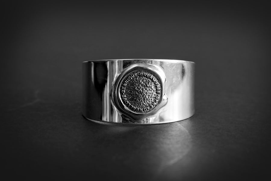Authentication stamp silver cuff